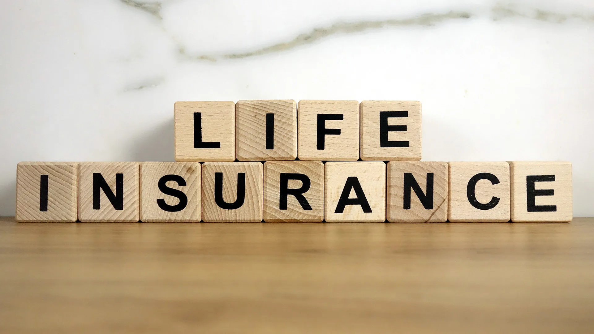 Life Insurance life insurance text from wooden blocks